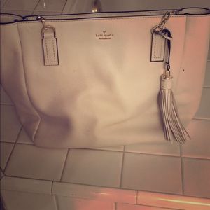 Real !! Kate spade white purse with strips inside